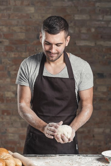 Male baker preparing bread bakery