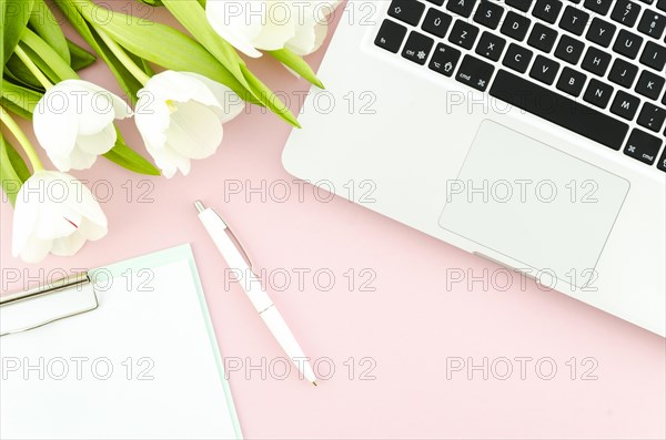Laptop with tulips clipboard table