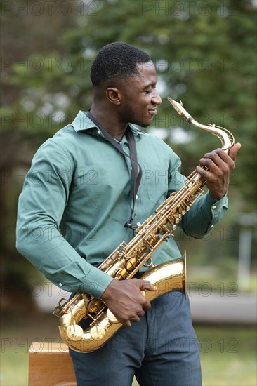 Young man playing instrument international jazz day 1