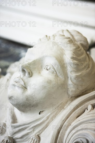 A woman's head in plaster for restoration by a plasterer