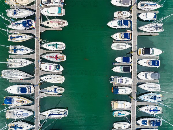 Top Down view over Boats and Yachts in Brixham Marina from a drone