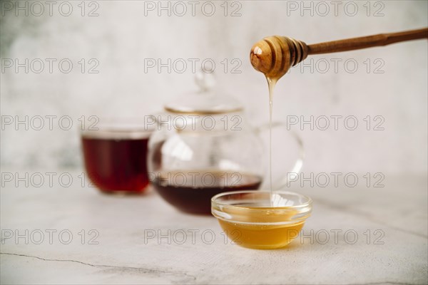 Front view tea honey blurred background