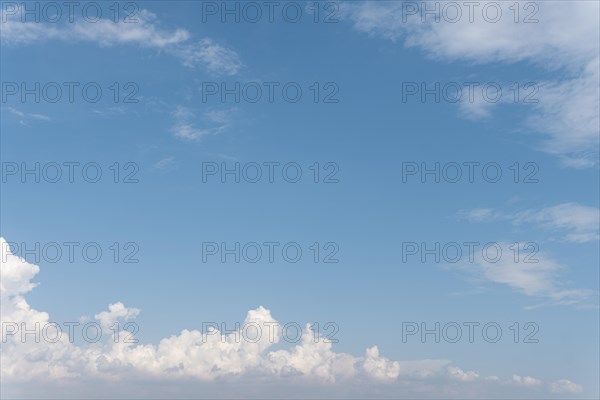 Blue sky fluffy clouds