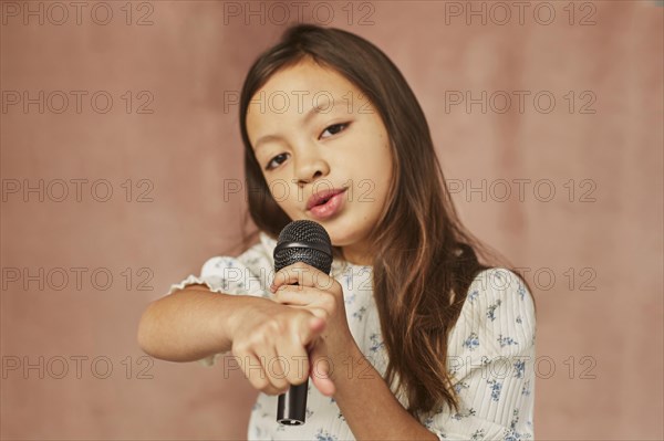 Little girl learning how sing home