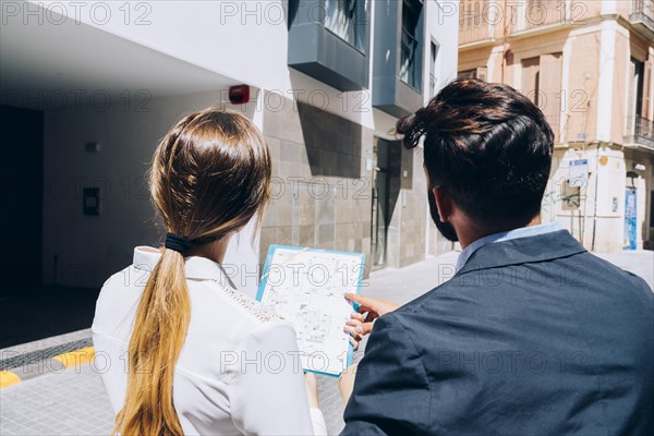 Real estate agents visiting building