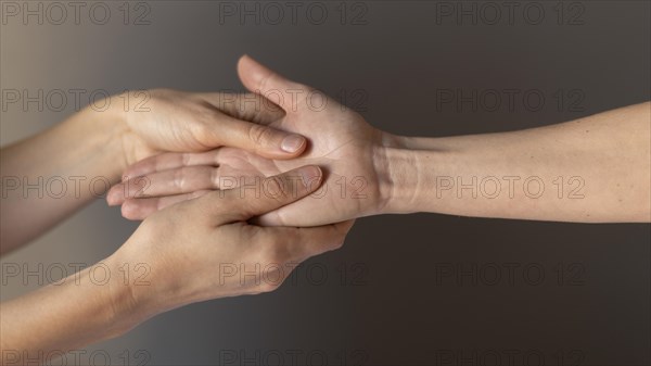 Close up hands massaging palm