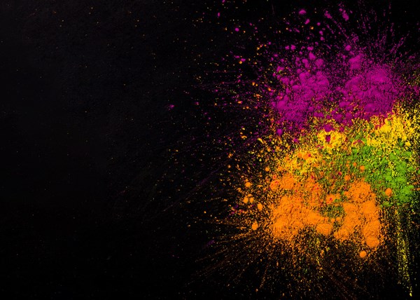 Explosion holi colors dark background