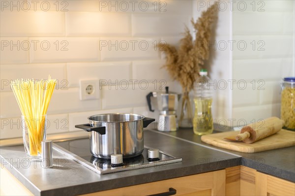 Modern apartment kitchen with pasta glass