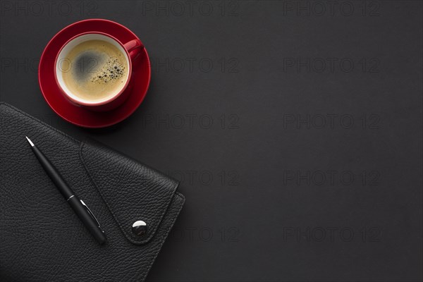 Flat lay work desk with agenda coffee cup