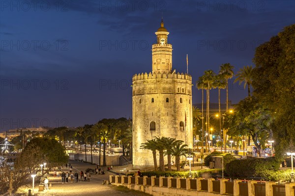 The historic Torre del Oro tower at dusk