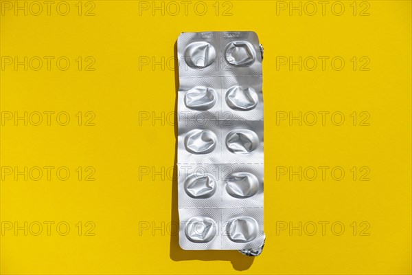 Empty tablet blister pack against a monochrome background
