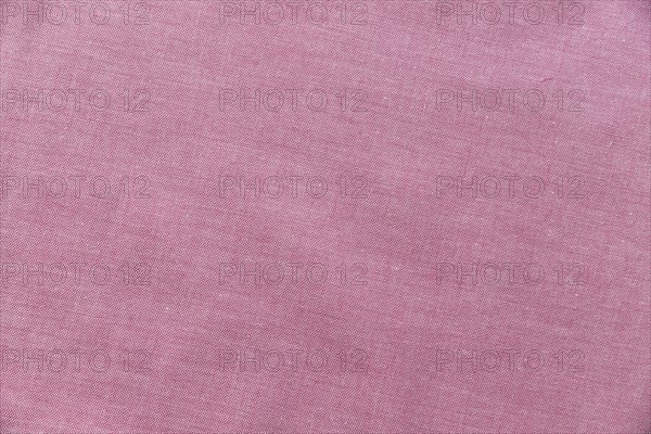 Elevated view pink textile background