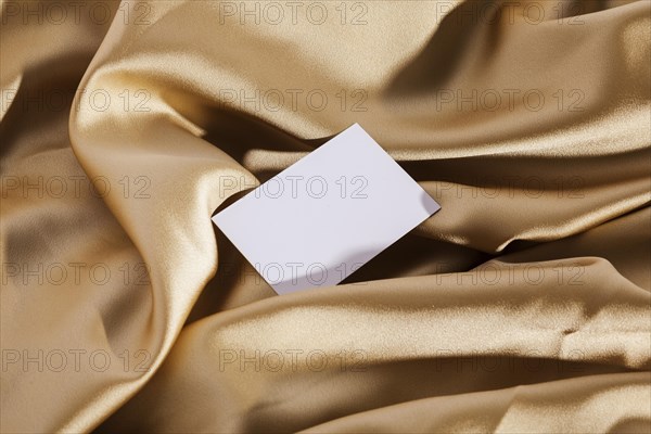 Top view white card golden cloth