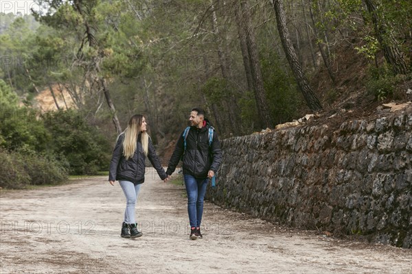 Couple with backpack exploring nature 4