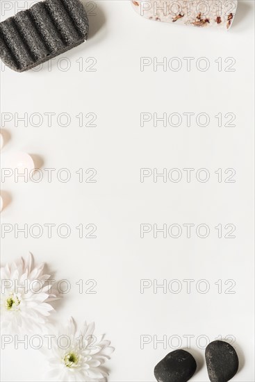 Pumice stone salt la stone candles flower white background