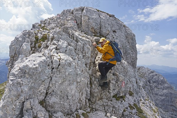 Hiker climbing the Guffertspitze