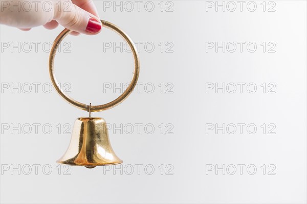 Woman holding small bell hand