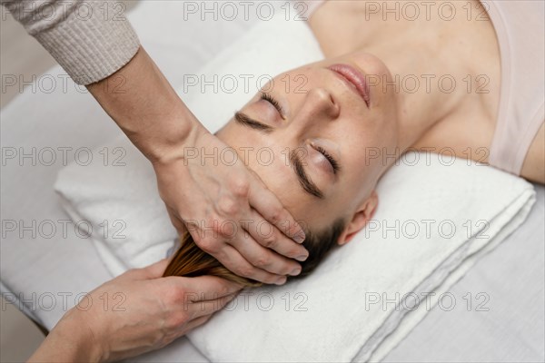Close up therapist massaging patient s hair