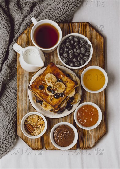 Top view breakfast toast with blueberries banana