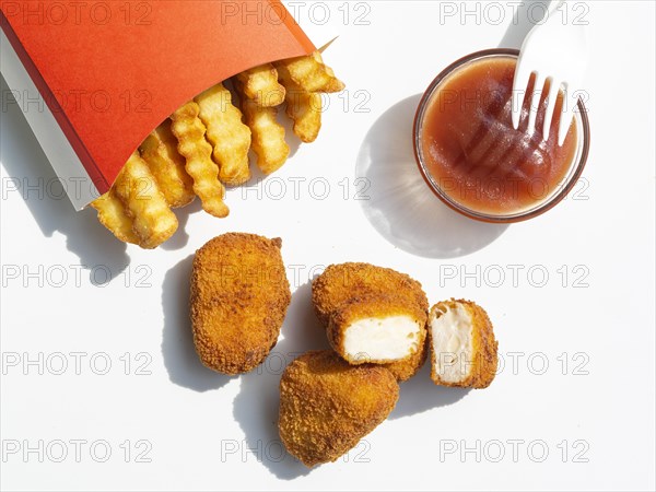 Top view french fries with ketchup nuggets