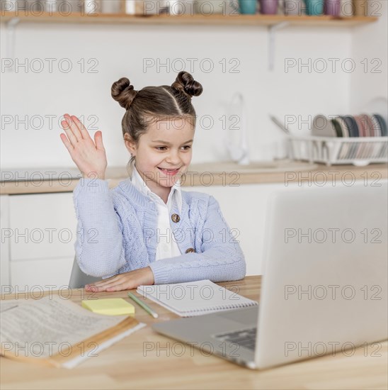 Little girl knowing answer her teacher s question