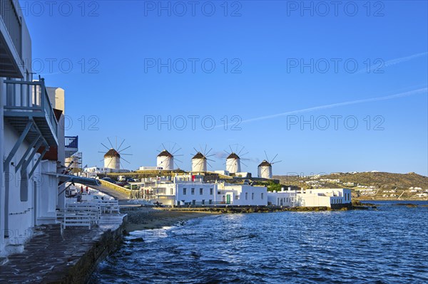 Beautiful view of famous traditional white windmills on top of hill