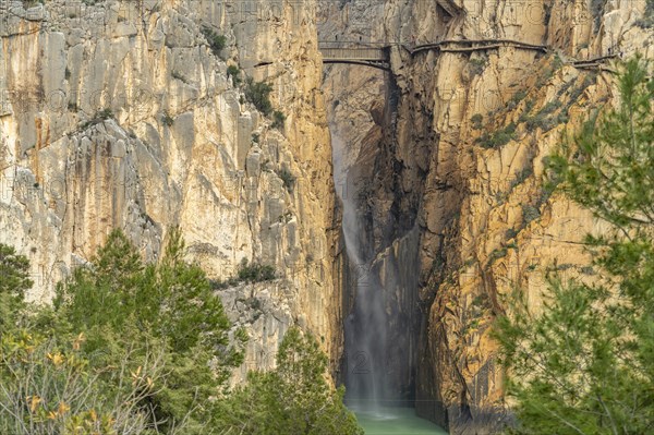 Suspension bridge and waterfall of the via ferrata Caminito del Rey near El Chorro