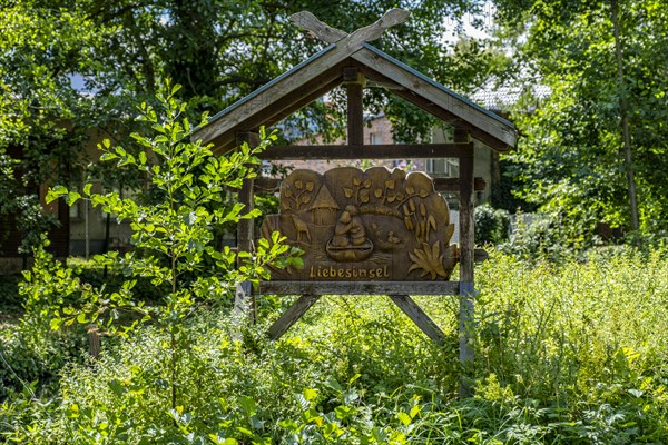 Wooden sign Love Island on the banks of the Spree