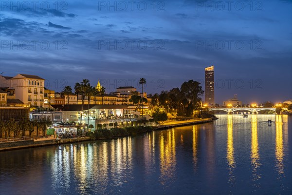 Triana neighbourhood on the banks of the Guadalquivir River at dusk