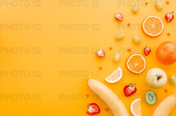 Assorted fruit yellow background