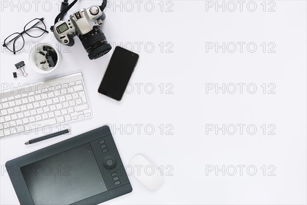 Digital camera graphic digital tablet keyboard mouse cellphone white background