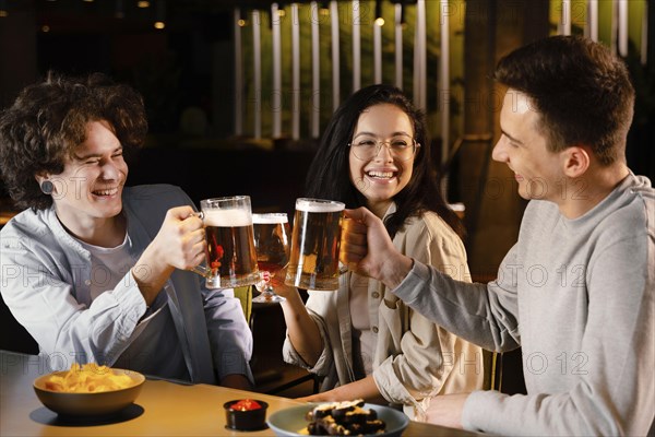 Medium shot friends holding beer mugs