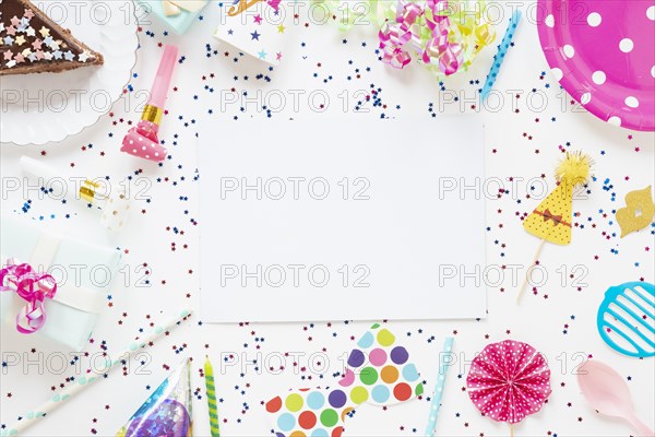 Top view composition festive birthday items with empty card