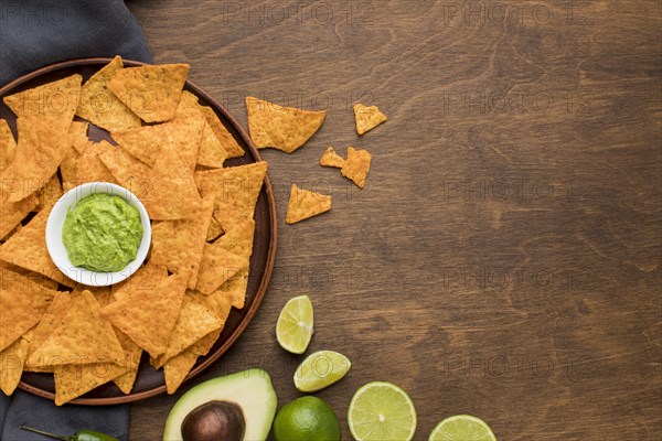 Top view tasty nachos with fresh guacamole