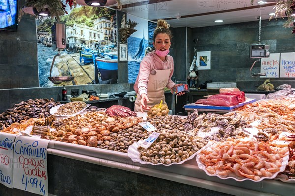 Saleswoman at the seafood stall