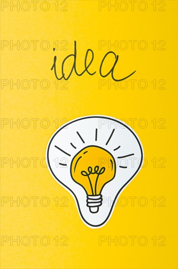 Light bulb idea concept yellow background