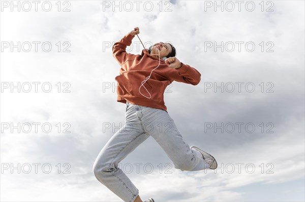 Portrait young beautiful female jumping