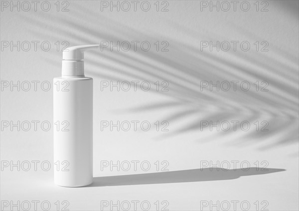 Skin care product with tropical leaf shadow