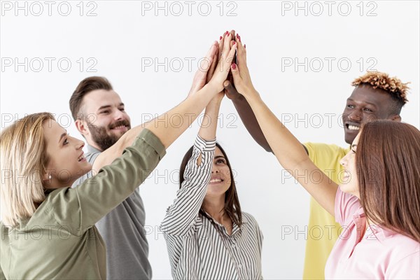 Group young friends high five air