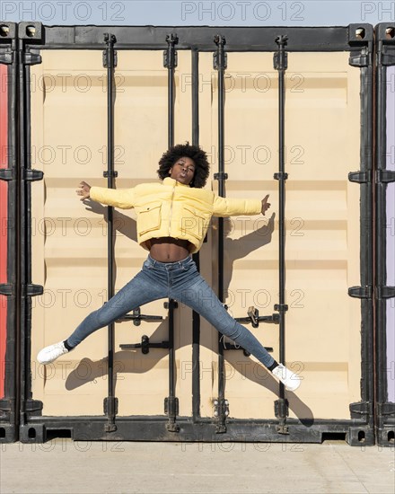 Portrait young woman jumping 1