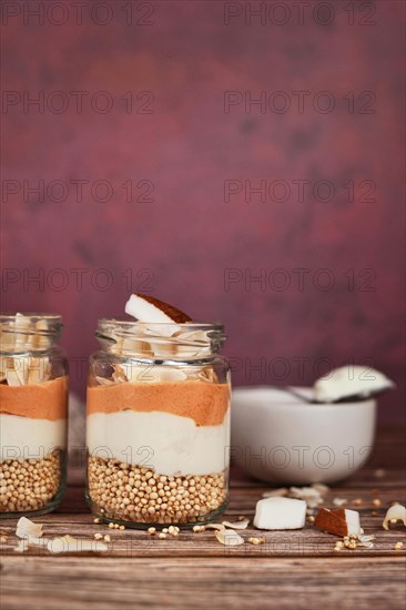 Healthy layered breakfast or dessert with puffed quinoa grains