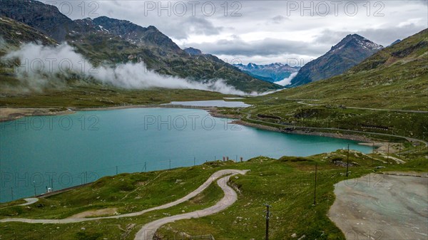 Aerial view bird's eye view of mountain lake at mountain pass alpine mountain road pass road Bernina Pass Bernina Pass