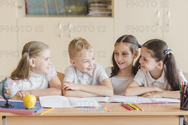 Cheerful kids chatting during lesson