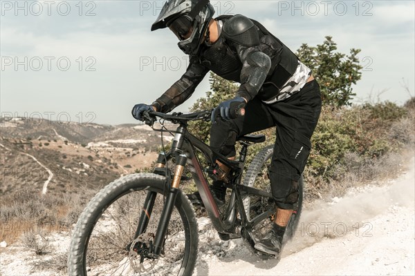 Man riding mountain bike outdoors