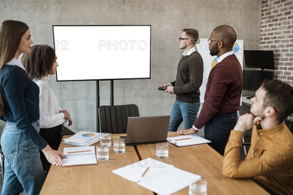 People during meeting showing presentation