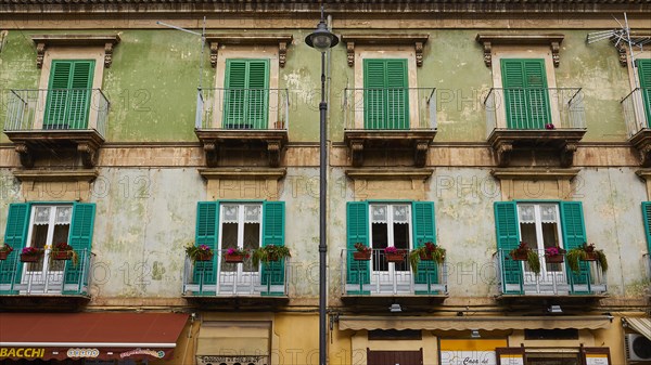 Pale green house front