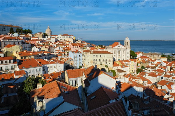 View of Lisbon famous postcard iconic view from Miradouro de Santa Luzia tourist viewpoint over Alfama old city district. Lisbon