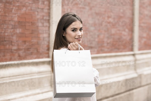 Shopping girl carrying bags