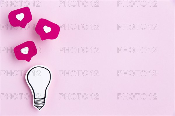 Paper ligh bulb with heart icon