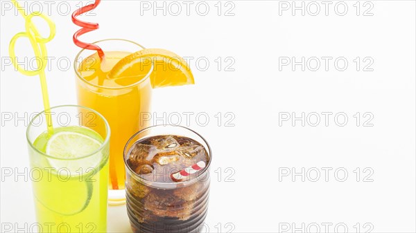 High angle glasses with soft drinks straws